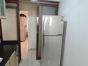 Kitchen in 2 BHK Apartment at Lokhandwala Breeze Apartments, Andheri West – for Rent