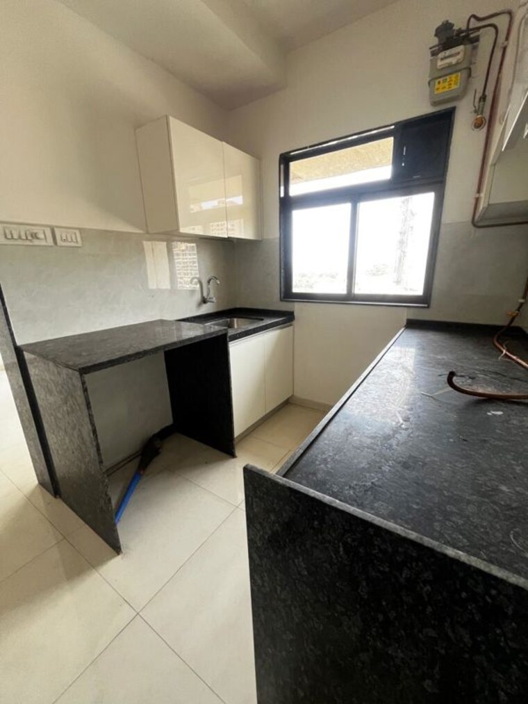 Kitchen, lalani-valentine-apartment-1-wing-d 1 Bedroom 405 Sq.Ft. Apartment In Malad East Mumbai 10311423