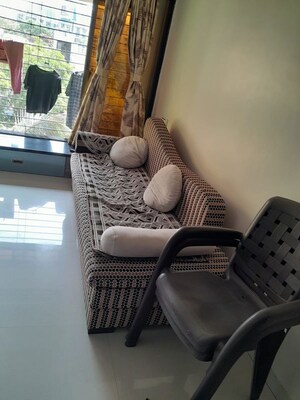 Living Room in 1 BHK Apartment at Aakanksha CHS, Borivali East – for Rent