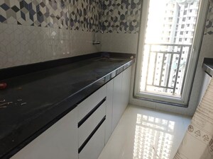 Kitchen in 1 BHK Apartment at Raunak Bliss Phase A3, Ghodbunder Road – for Rent