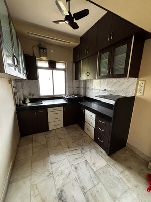 Kitchen in 2 BHK Apartment at Riddhi Garden, Malad East – for Rent