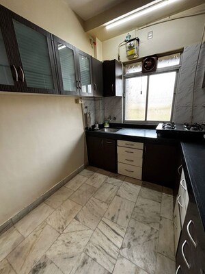 Kitchen in 2 BHK Apartment at Riddhi Garden, Malad East – for Rent