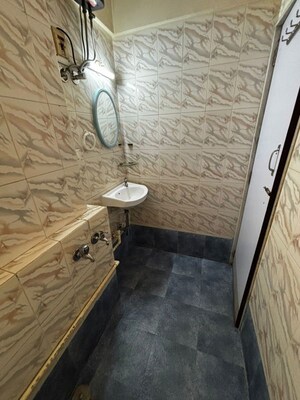 Bathroom in 2 BHK Apartment at Riddhi Garden, Malad East – for Rent