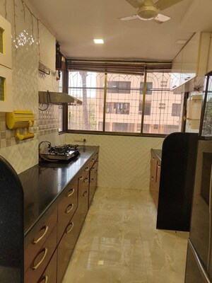 Kitchen in 2 BHK Apartment at Wood Rose CHS, Andheri West – for Rent