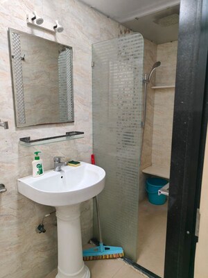 Bathroom in 2 BHK Apartment at Wood Rose CHS, Andheri West – for Rent