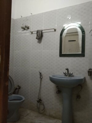 Bathroom in 4 BHK Builder Floor at Green Park Extension – for Rent
