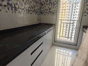 Kitchen in 1 BHK Apartment at Raunak Bliss Thane, Ghodbunder Road – for Sale