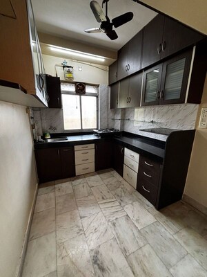 Kitchen in 1 BHK Apartment at Riddhi Gardens CHS, Malad East – for Rent