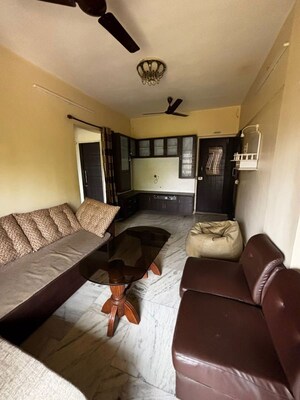 Living Room in 1 BHK Apartment at Riddhi Gardens CHS, Malad East – for Rent