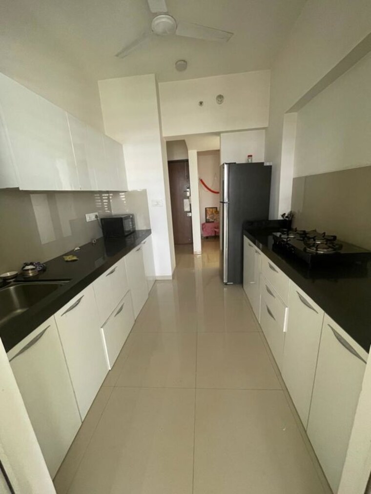 Kitchen, lodha-belmondo 2 Bedroom 1400 Sq.Ft. Apartment In Gahunje Pune 10313604