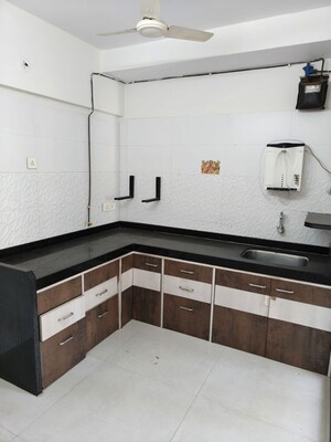 Kitchen in 2 BHK Apartment at Rattan Icon, Seawoods Sector 50 – for Sale