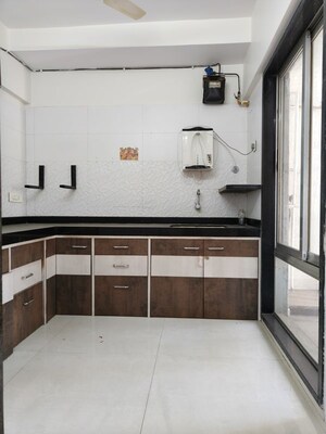 Kitchen in 2 BHK Apartment at Rattan Icon, Seawoods Sector 50 – for Sale