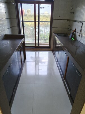 Kitchen in 2 BHK Apartment at Rattan Icon, Seawoods Sector 50 – for Rent