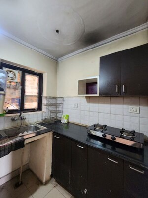 Kitchen in Studio Apartment at Jaipuria Sunrise Green, Lohgarh – for Rent