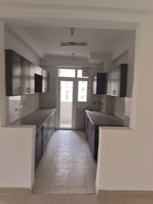 Kitchen in 4 BHK Apartment at Amrapali Silicon City, Sector 76 – for Rent