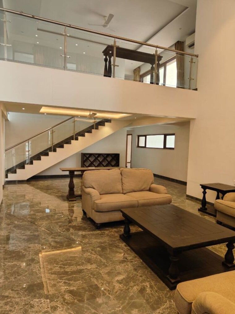 Living Room, clover-realty-delta-empress 5 Bedroom 8486 Sq.Ft. Apartment In Sopan Baug Pune 10313937