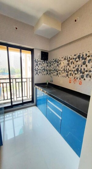 Kitchen in 1 RK Apartment at Raunak Unnathi Woods Phase 7 A And B, Ghodbunder Road – for Rent