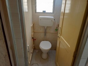 Bathroom in 1 BHK Apartment at Nagari Niwara CHS, Goregaon East – for Rent