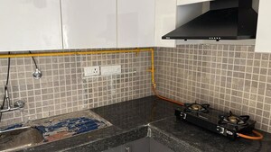 Kitchen in 2.5 BHK Apartment at Nimbus The Golden Palm, Sector 168 – for Rent