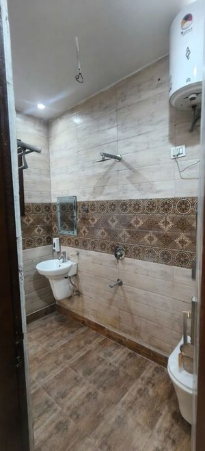 Bathroom in 3 BHK Builder Floor at Dhakoli – for Sale