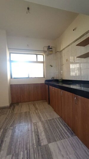 Kitchen in 2 BHK Apartment at Happy Valley, Manpada – for Rent