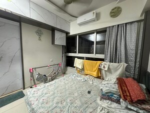 Bedroom in 2 BHK Apartment at Neelam Senroofs, Nahur East – for Rent