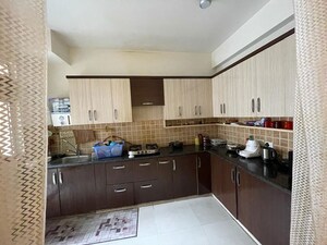 Kitchen in 4 BHK Apartment at Mahagun My Woods, Sector 16c Greater Noida – for Rent