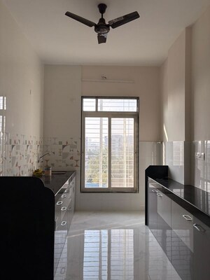 Kitchen in 2 BHK Apartment at Mellennium Dreams Apartments, Dombivli West – for Sale