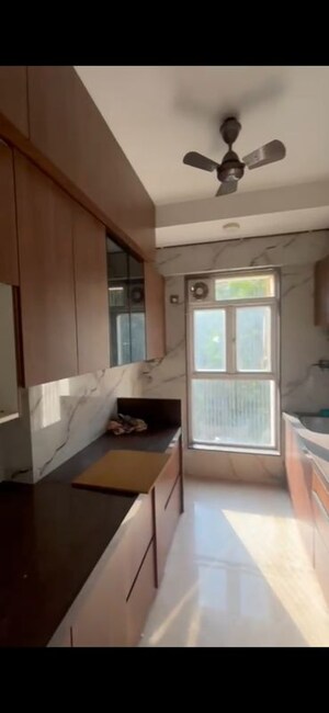 Kitchen in 3 BHK Apartment at Ashish CHS Chincholi Phatak, Malad West – for Rent