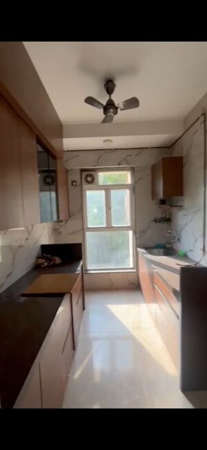 Kitchen in 3 BHK Apartment at Ashish CHS Chincholi Phatak, Malad West – for Rent