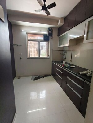 Kitchen in 1 BHK Apartment at Puranik City, Kasarvadavali – for Rent