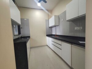 Kitchen in 2 BHK Apartment at Omkar Signet, Malad East – for Rent