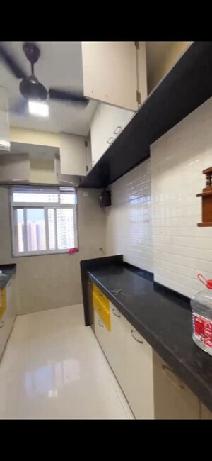 Kitchen in 2 BHK Apartment at Dhoot Sky Residency New Sonali CHSL, Malad West – for Rent