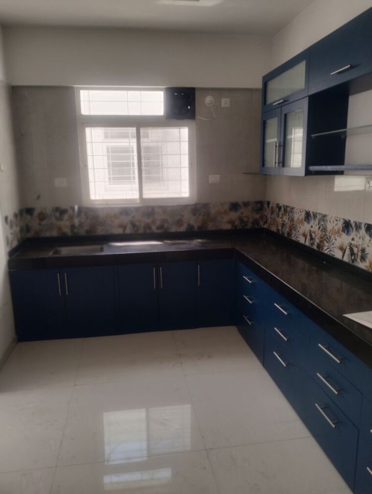Kitchen, dynamic-grandeur 2 Bedroom 1050 Sq.Ft. Apartment In Undri Pune 10318513