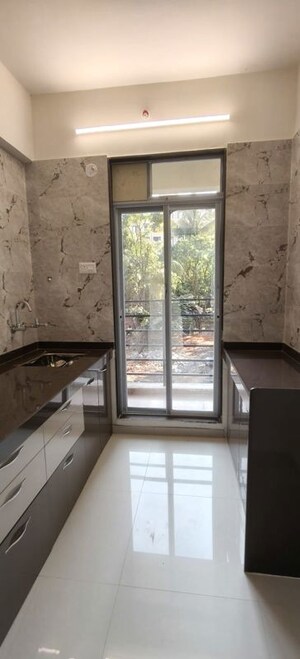 Kitchen in 1 BHK Apartment at Patel Meadows, Joveli – for Sale