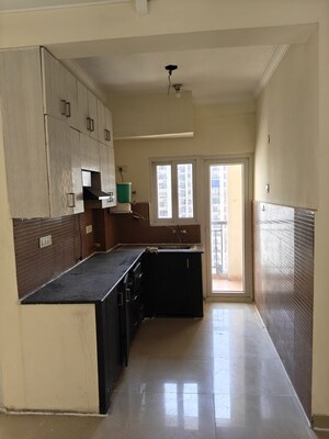Kitchen in 2.5 BHK Apartment at Antriksh Golf View, Sector 78 – for Rent