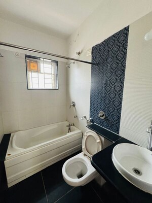 Bathroom in 4 BHK Apartment at Shivranjani Apartment, Kothrud – for Sale