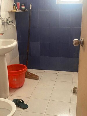 Bathroom in 2 BHK Apartment at Raj Nagar Extension – for Sale