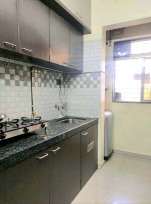 Kitchen in 2 BHK Apartment at Asha Nagar CHS, Mulund West – for Rent