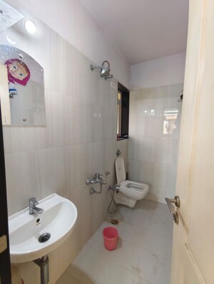 Bathroom in 1 BHK Apartment at Puranik City, Kasarvadavali – for Rent