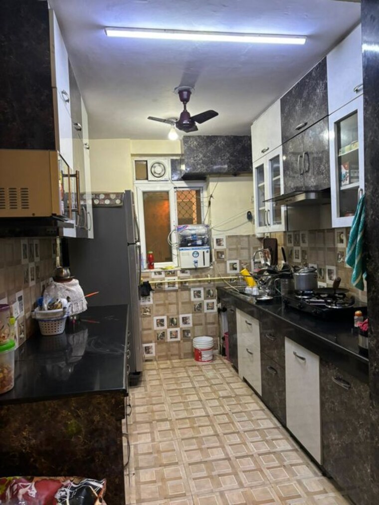 Kitchen, sikka-karmic-greens 3.5 Bedroom 1620 Sq.Ft. Apartment In Sector 78 Noida 10319356