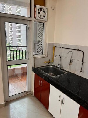 Kitchen in 3 BHK Apartment at JKG Palm Court, Sector 16c Greater Noida – for Rent