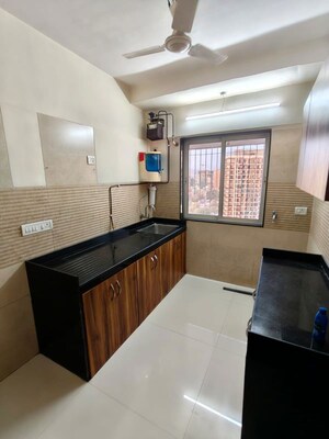 Kitchen in 3 BHK Apartment at Romell Diva, Malad West – for Rent