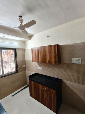 Kitchen in 3 BHK Apartment at Romell Diva, Malad West – for Sale