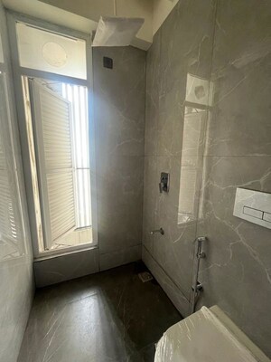 Bathroom in 3 BHK Apartment at Ruparel Palacio Phase 1, Kandivali West – for Rent