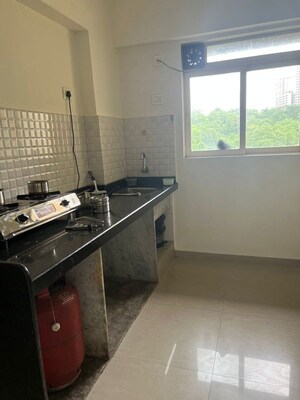Kitchen in 1 BHK Apartment at Kavya Hill View CHS, Anand Nagar – for Sale