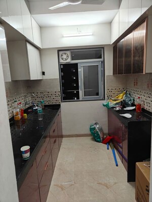 Kitchen in 1 BHK Apartment at Metropolis Bayside, Kasarvadavali – for Rent