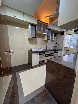 Kitchen in 3 BHK Apartment at DB Realty Shagun Towers, Goregaon East – for Rent