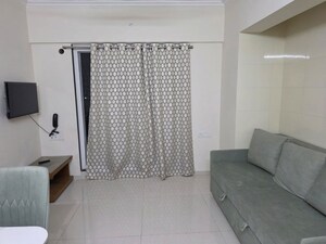 Living Room in 1 BHK Apartment at Raunak Bliss Thane, Ghodbunder Road – for Rent