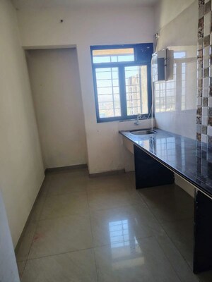 Kitchen in 1 BHK Apartment at Virat Green Avenue, Shilphata – for Sale